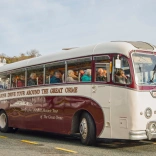 People on a vintage coach tour